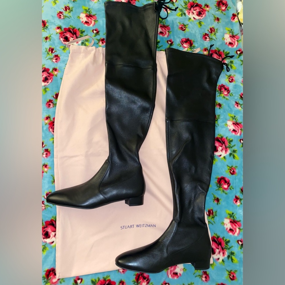 Stuart Weiztman over the knee leather boots with back ties.